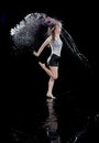 Girl dancing rain black background