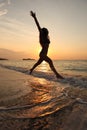 Girl DANCING IN SUNSET ON SEA Royalty Free Stock Photo