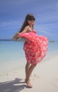 Girl dancing on the white sandy beach Royalty Free Stock Photo