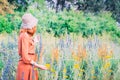 Girl on dandelion on green field. Royalty Free Stock Photo
