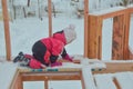 a girl is dangerous to climb on the construction of a frame house in the winter, a brave child