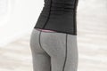 Girl in a dark corset gray leggings