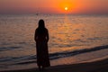 Girl and the sea. Sunrise on the sea coast Royalty Free Stock Photo