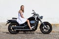 Girl the day of the confirmation on a motorcycle Royalty Free Stock Photo