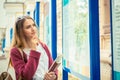 Girl daydreaming about career. Future student with sunglasses bag pack books in hand looking up at college stands thinking what Royalty Free Stock Photo