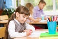 Girl decides to task on the exam Royalty Free Stock Photo