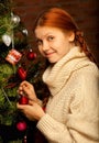 Girl decorate the Christmas tree