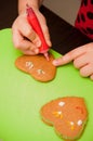 Girl decorating gingerbread