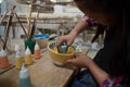 Girl decorating painting bowl