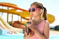 Girl with delicious drink in water park Royalty Free Stock Photo