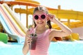 Girl with delicious drink in water park Royalty Free Stock Photo