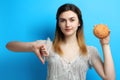 Girl with a delicious sweet bun Royalty Free Stock Photo