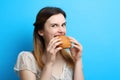 Girl with a delicious sweet bun Royalty Free Stock Photo