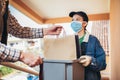 Girl is delivering some groceries to an elderly person. Contactless delivery during the quarantine Royalty Free Stock Photo