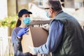 Girl is delivering some groceries to an elderly person, during the epidemic coronovirus, COVID-19 Royalty Free Stock Photo