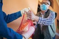 Girl is delivering some groceries to an elderly person Royalty Free Stock Photo