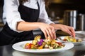 girl demonstrating plating technique with colorful roasted cauliflower dish