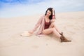 Girl in desert sit, dream and smile Royalty Free Stock Photo