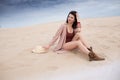 Girl in desert sit, dream and smile, sand and blu sky Royalty Free Stock Photo