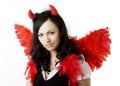 Girl in a devil costume with a gift