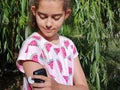 Girl with diabetes checks glucose level in blood with device for continuous glucose monitoring Ã¢â¬â CGM. Royalty Free Stock Photo