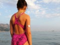 The girl with diabetes is standing on the seashore. On right arm is  white sensor for continuous glucose monitoring Ã¢â¬â CGM. Royalty Free Stock Photo