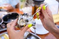 The girl dines with oysters. Royalty Free Stock Photo