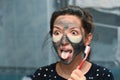 Girl disgusted to brush her teeth. Bad toothpaste. girl in the bathroom. Personal hygiene. Red brush Royalty Free Stock Photo