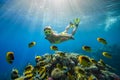 Girl dives in a tropical sea