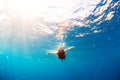 Girl diving under the sea Royalty Free Stock Photo