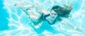 Girl diving underwater in swimming pool Royalty Free Stock Photo