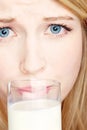 Girl do not like to drink milk Royalty Free Stock Photo