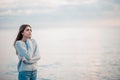 Girl in a sweater near the sea Royalty Free Stock Photo