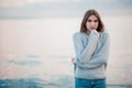 Girl in a sweater near the sea Royalty Free Stock Photo