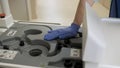 Girl doctor carries a radioactive capsule for the installation of an MRI