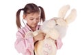 Girl, a doctor, the child, rabbit toy