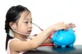 Girl doctor cure with piggy bank, money concept..