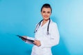 Girl doctor with folder and a stethoscope Royalty Free Stock Photo