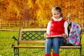 Girl does homework in the park Royalty Free Stock Photo