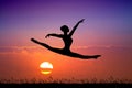Girl does the splits at sunset Royalty Free Stock Photo