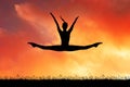 Girl does the splits at sunset Royalty Free Stock Photo