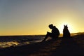 The girl with a dog on the coast