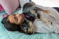 Teen girl sleeping in her bed with her dog Royalty Free Stock Photo