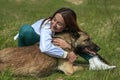 Girl And a Dog Hugs