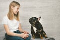 Girl and the dog look at each other. Copy space Royalty Free Stock Photo