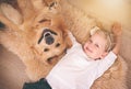 Girl, dog and portrait together on floor in living room or golden retriever, kid and smiling with pet above lounge Royalty Free Stock Photo