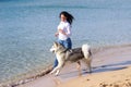 Girl dog running beach Royalty Free Stock Photo