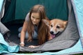 Girl and dog in a tent Royalty Free Stock Photo