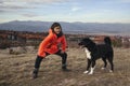 Girl and dog walk on the mountain Royalty Free Stock Photo