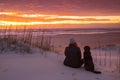 Girl and Dog Watching Sunrise in Outer Banks NC